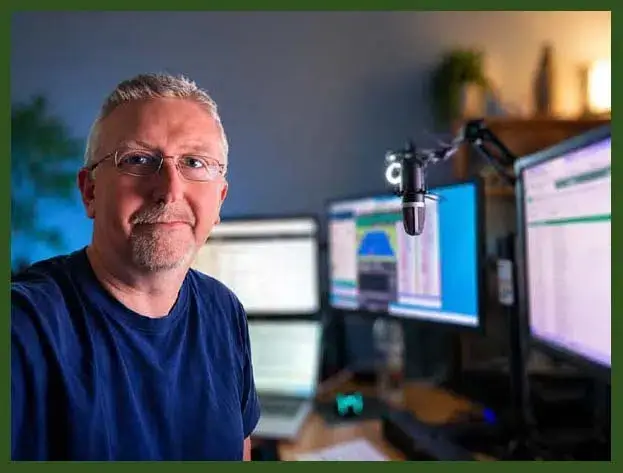 Image of Paul sat at his desk